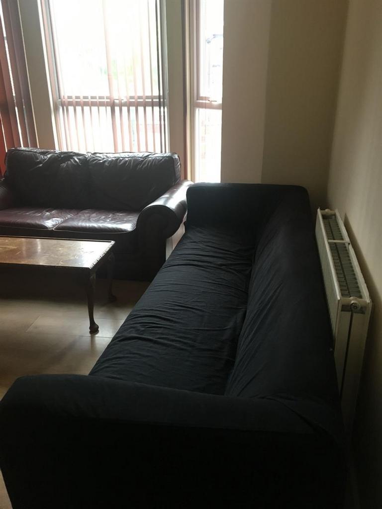 Comfortable living room with two sofas arranged...