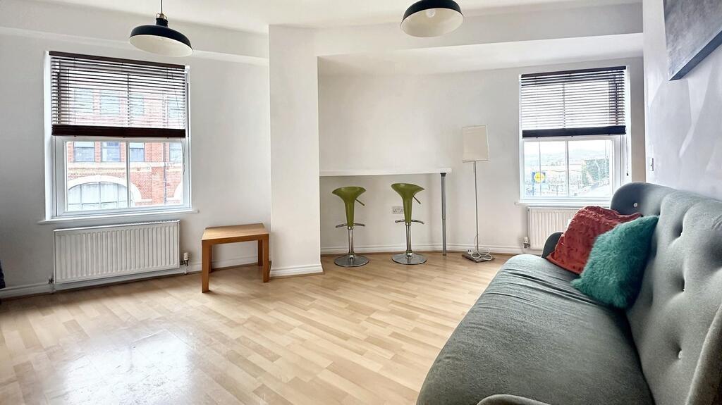Bright, modern living room with large windows, ...