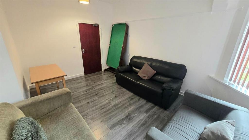 Bright, tidy living room with modern laminate f...