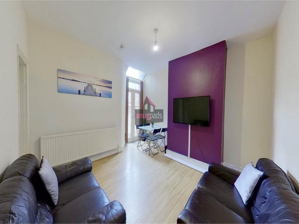 Bright, modern living room with comfortable lea...