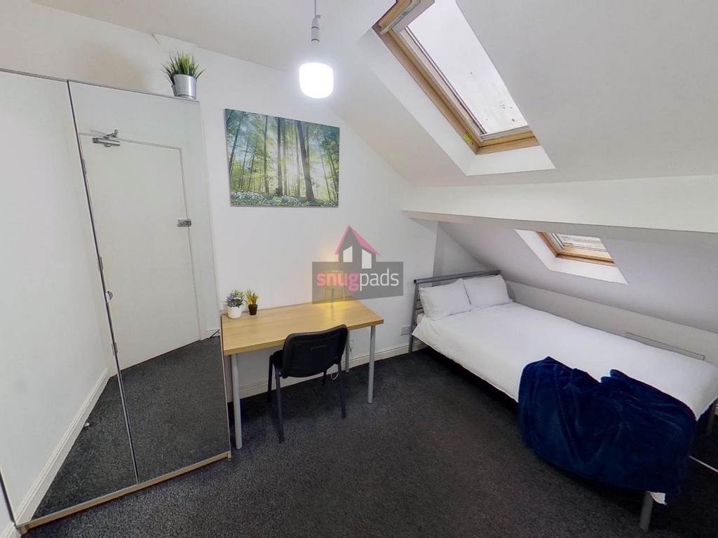 Neat attic-style single bedroom with a bedside ...