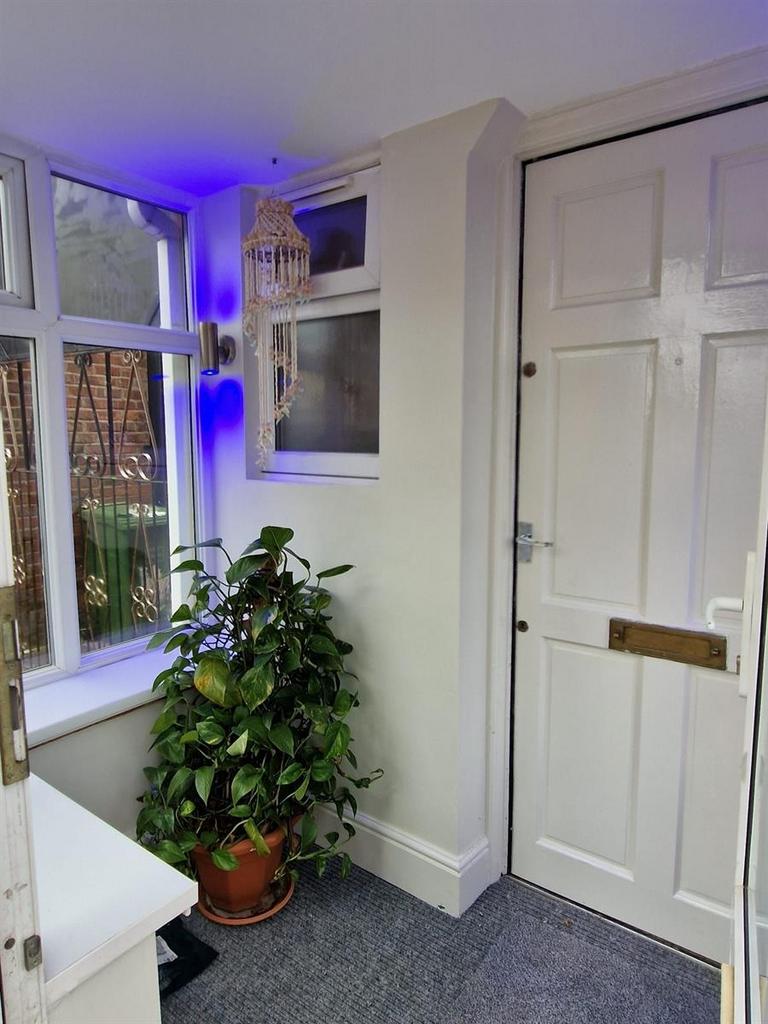 Bright, welcoming entrance hall with a white fr...