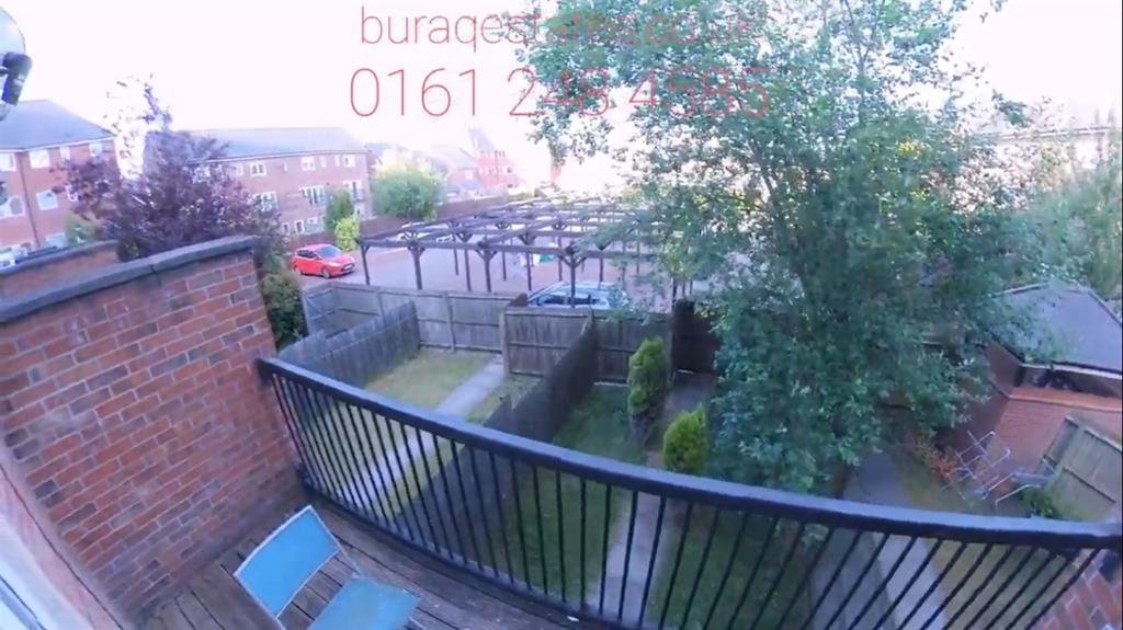 Well-kept private garden with a paved patio, ra...