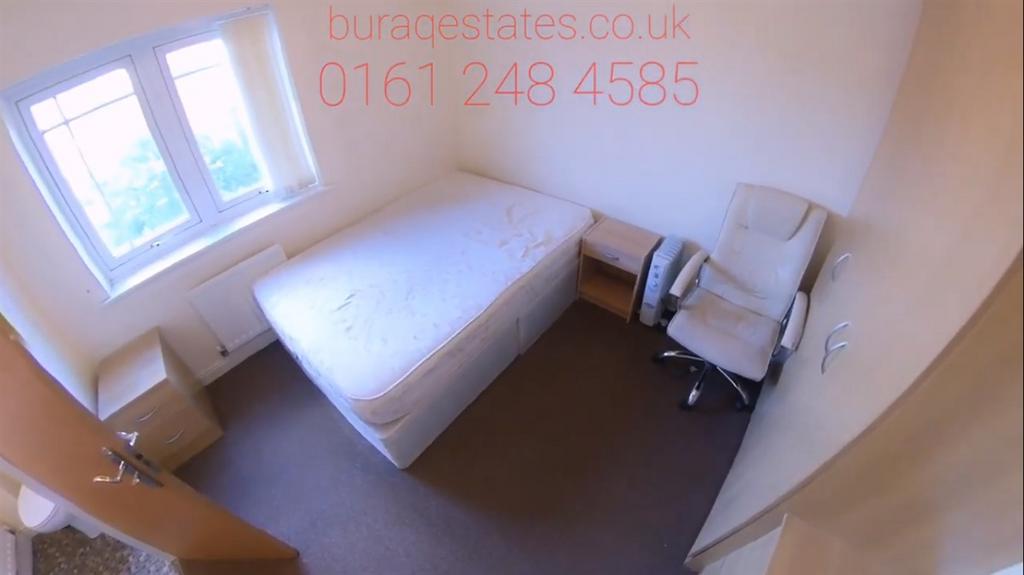 Bright, simply furnished single bedroom with a ...