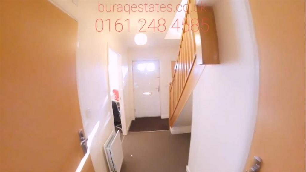 Bright entry hallway with neutral walls, fitted...