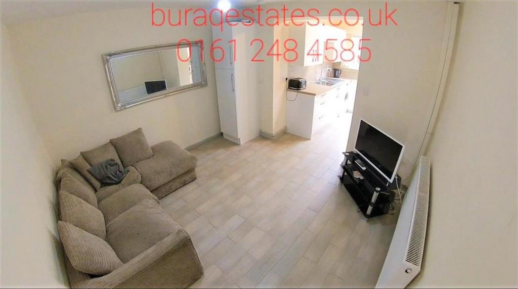 Bright, neatly presented living room with a com...