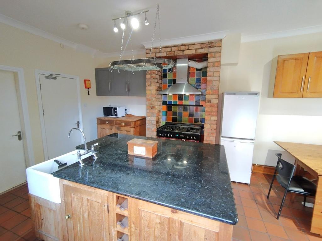 Bright, well-equipped kitchen with a central is...