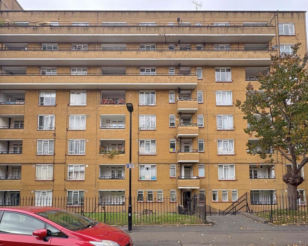 Brick-faced mid-rise apartment block with balco...