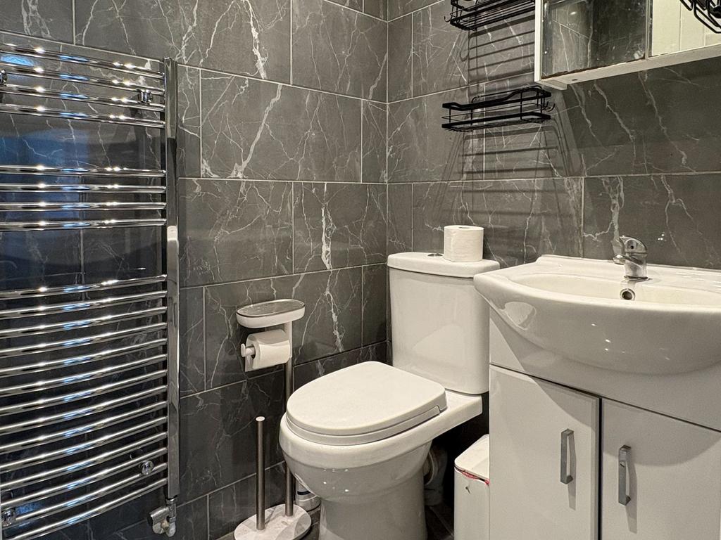 Contemporary tiled bathroom with modern fixture...