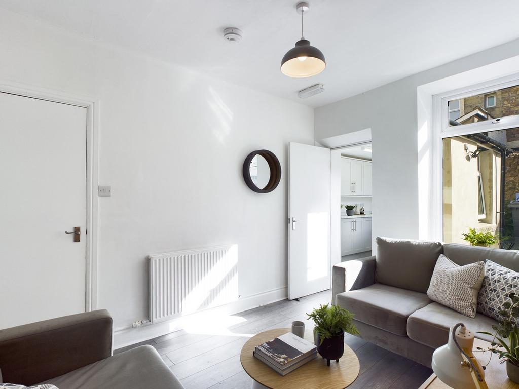 A spacious and inviting modern living room fill...