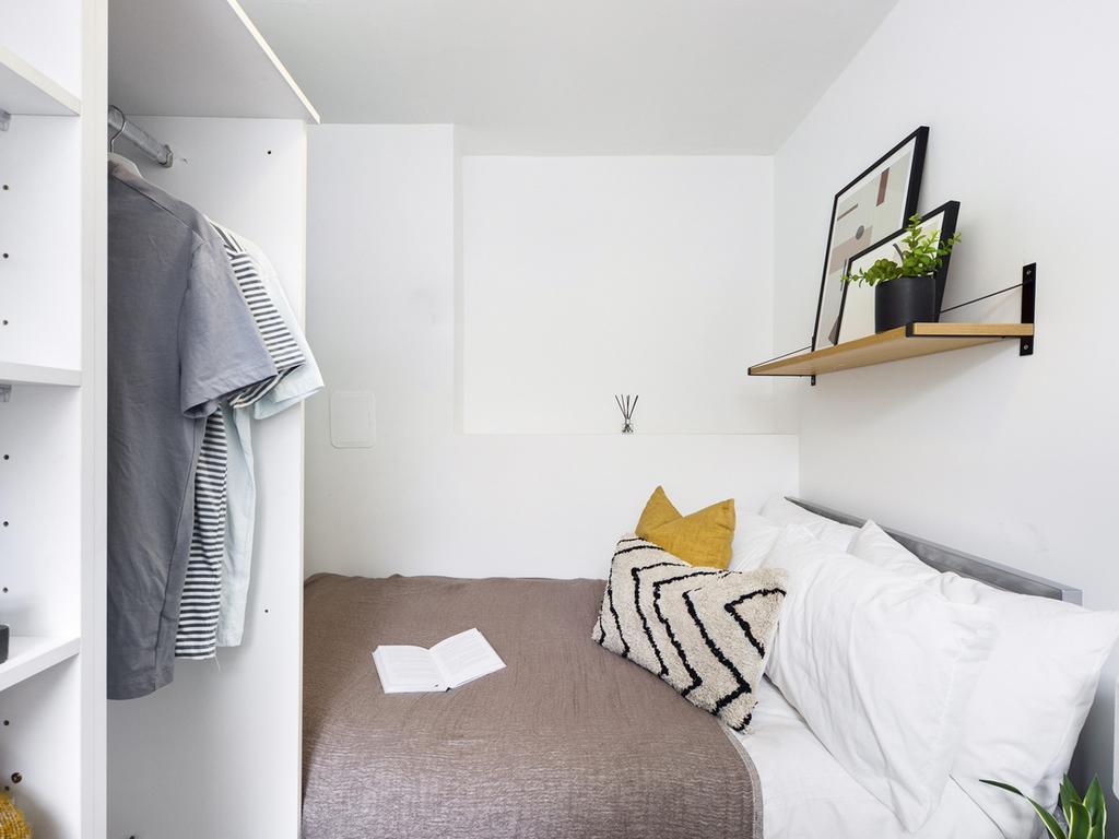 A bright and cozy double bedroom featuring a st...