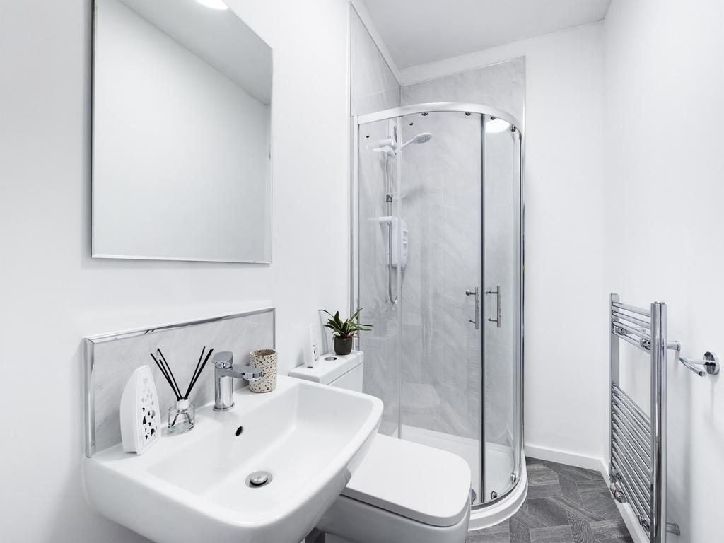 A modern and clean bathroom featuring a stylish...