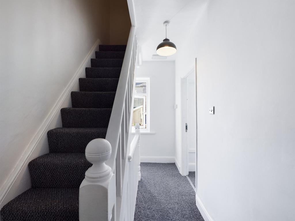 A clean and tidy hallway leading to other rooms...