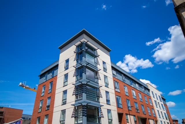 Modern multi-storey apartment building with a m...