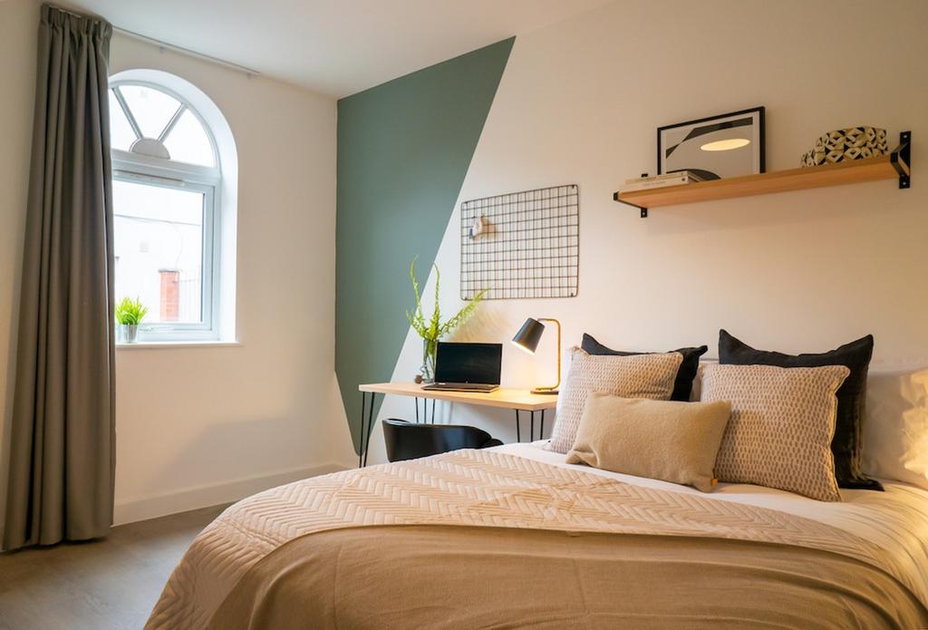 A stylish and inviting double bedroom featuring...