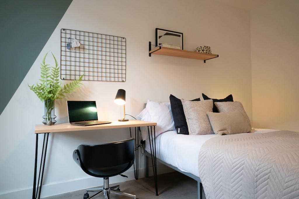 A stylish and well-arranged double bedroom feat...