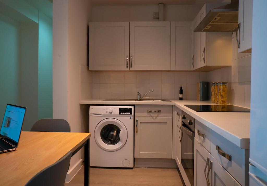 A modern kitchenette featuring clean lines and ...