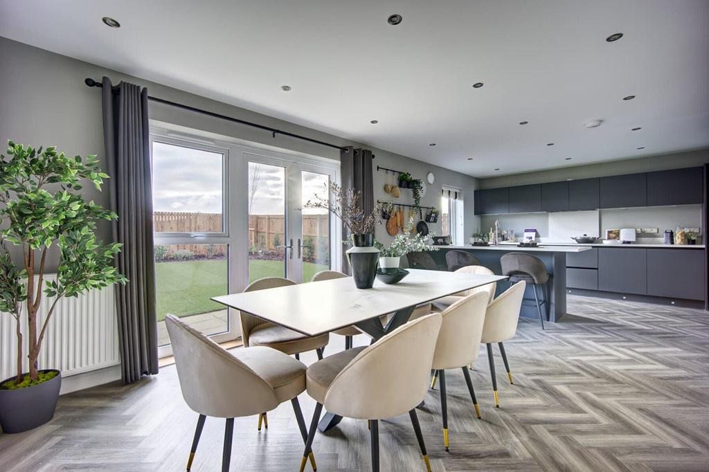 A sociable dining area with French doors to the...