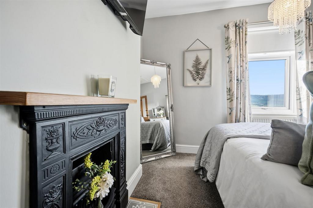 Bedroom Three - fireplace and window.jpg