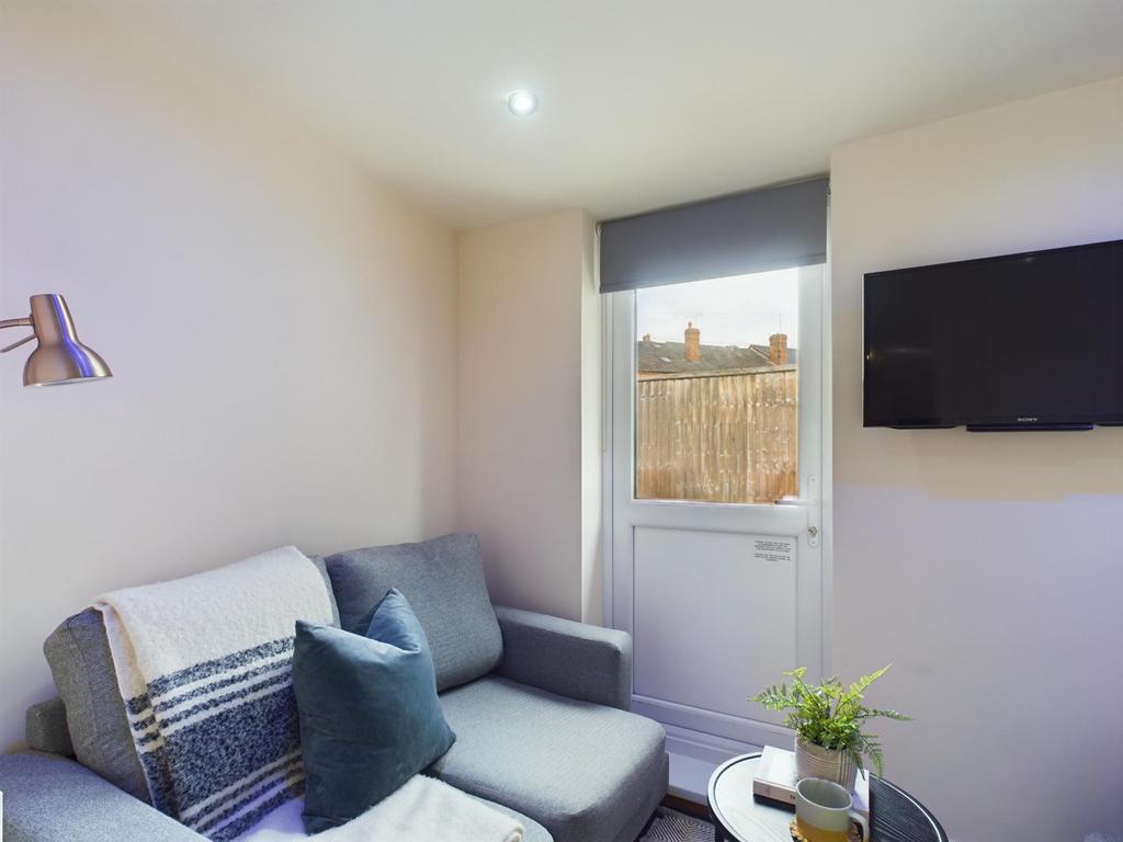 A bright and inviting living room with modern d...