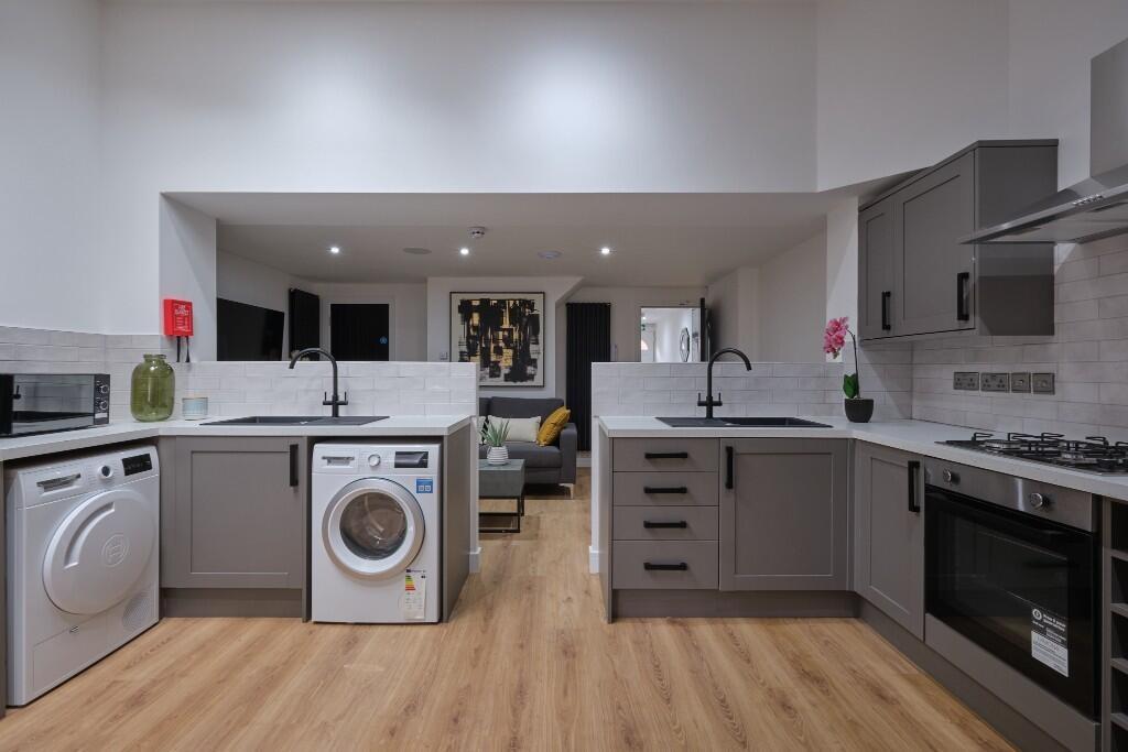 A modern, well-lit kitchen with a clean and org...