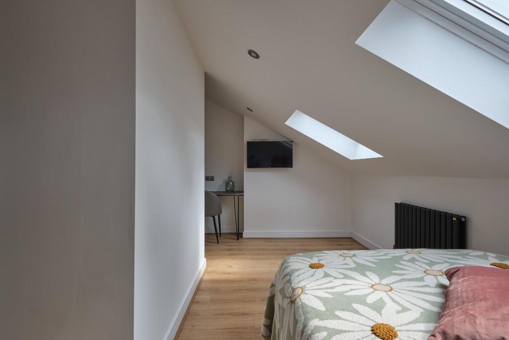 Bright and modern living room with ample natura...
