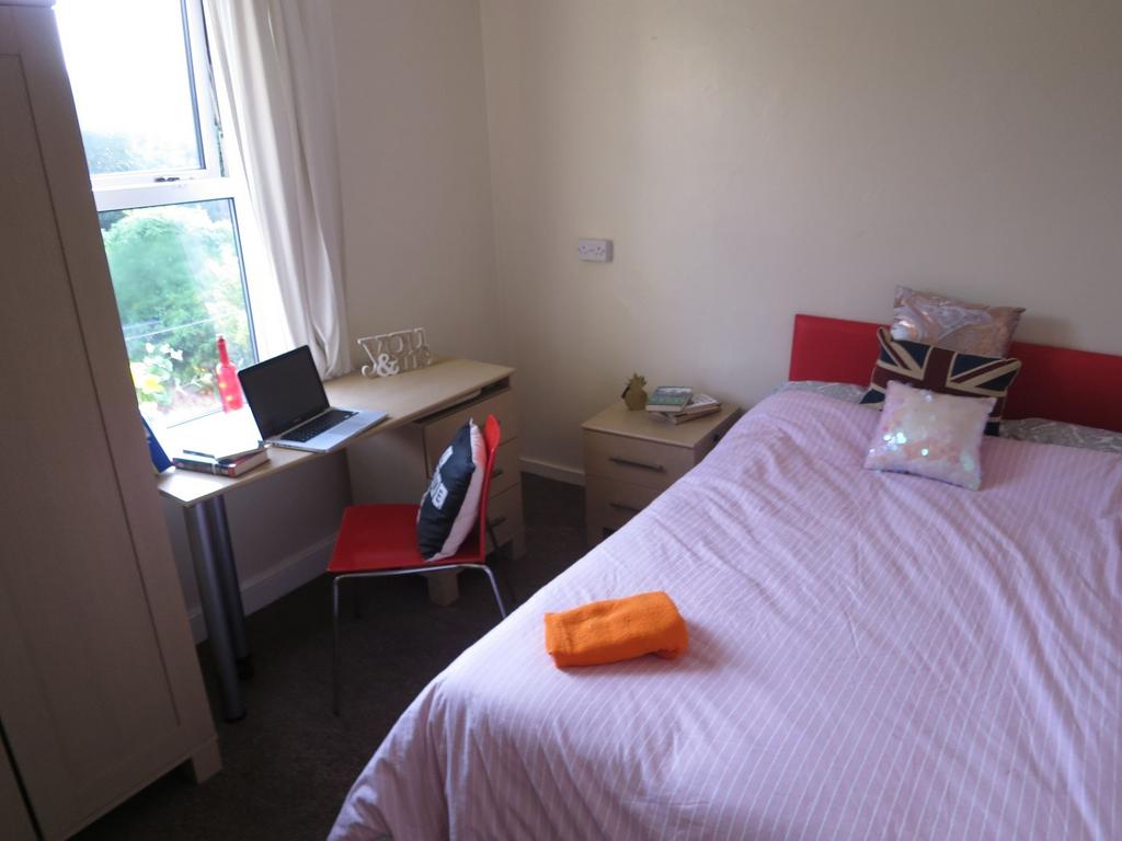 Bright, neatly presented bedroom with a double ...