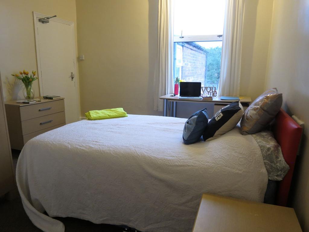 Bright, neatly presented bedroom with a comfort...
