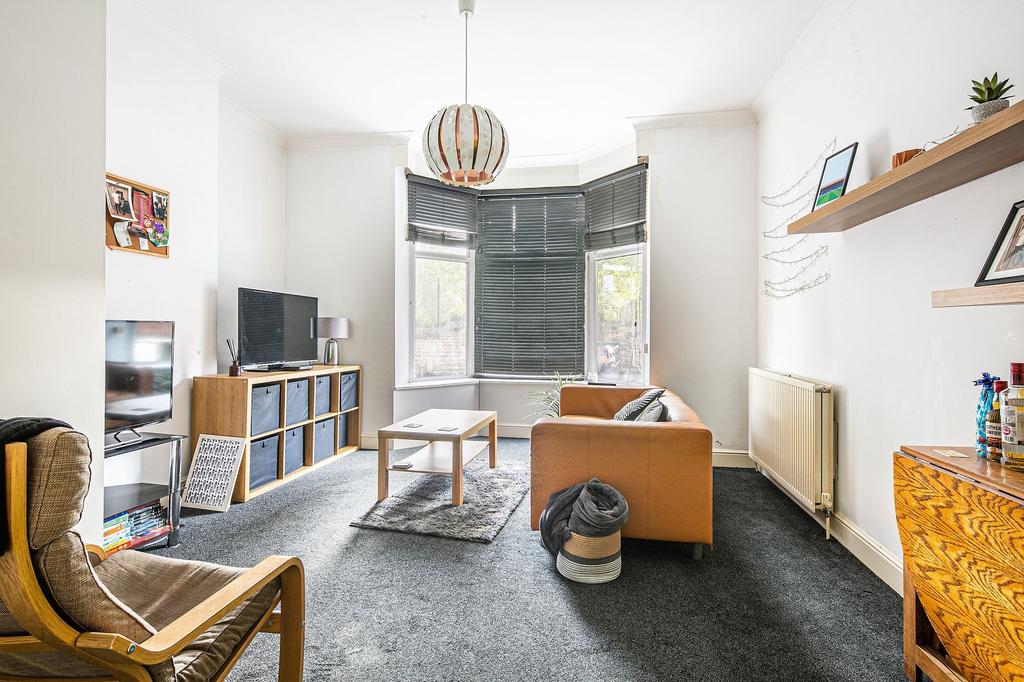 Bright, well-presented living room with a bay w...