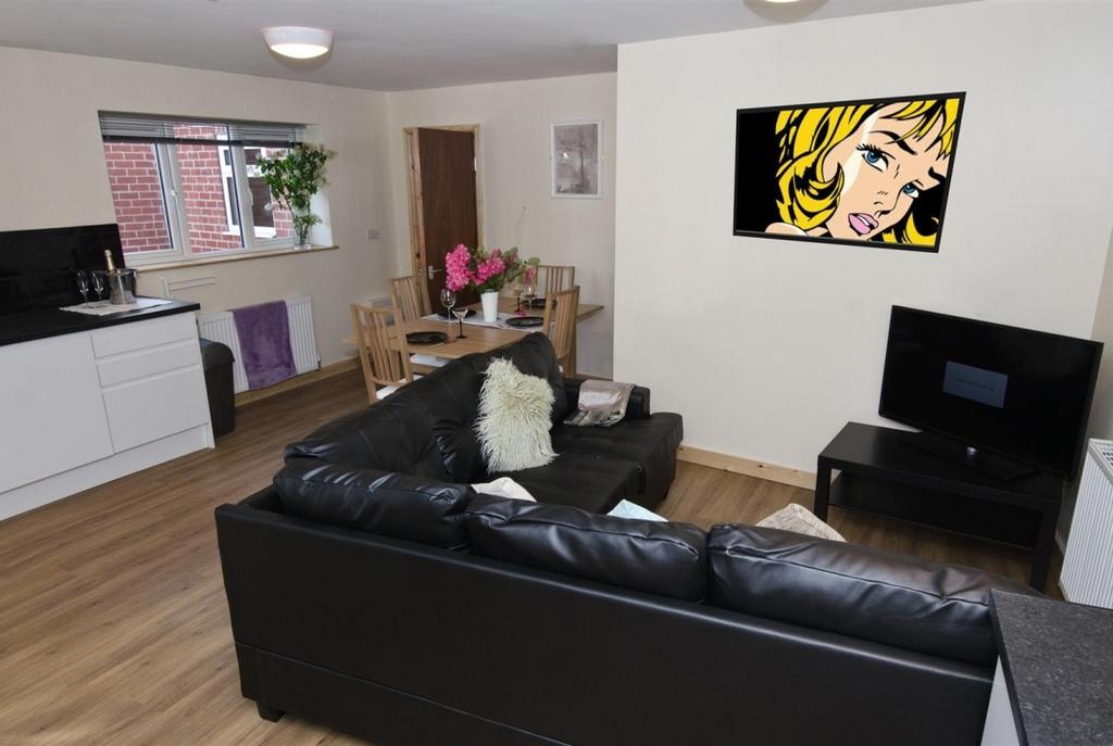 Contemporary open-plan living area with a black...