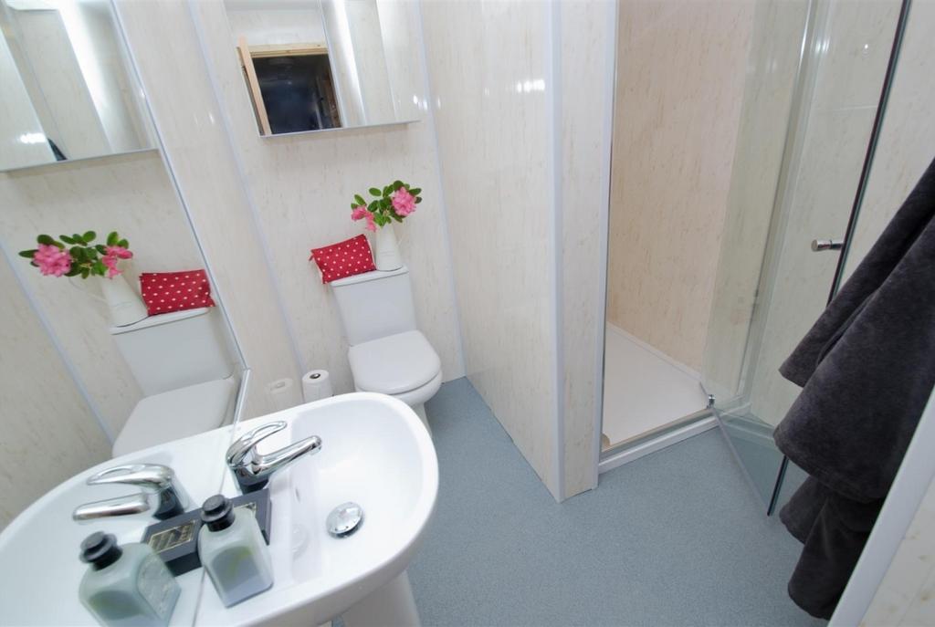 Bright, well-maintained bathroom with a clean p...