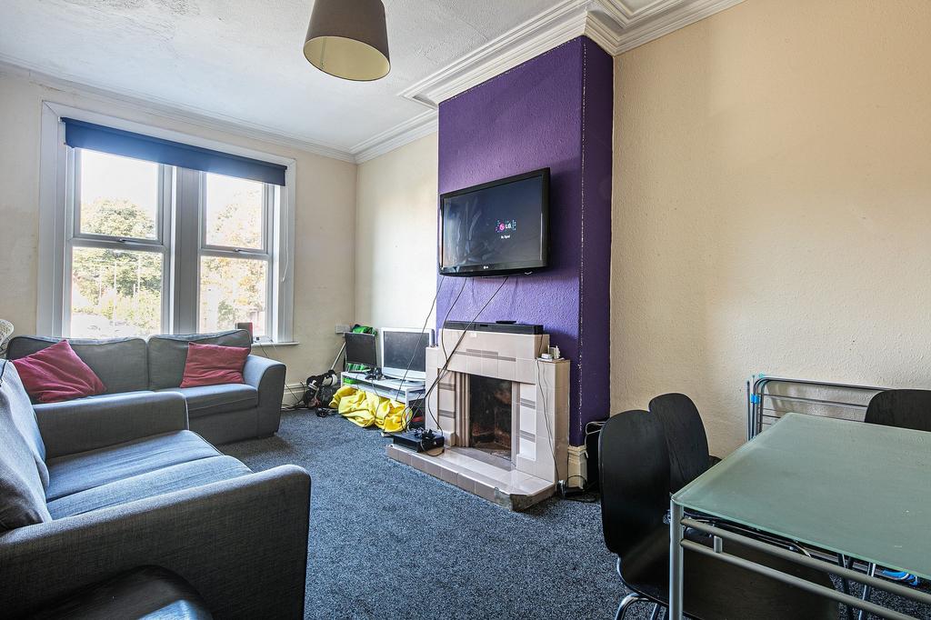 Bright and comfortable living room with large f...