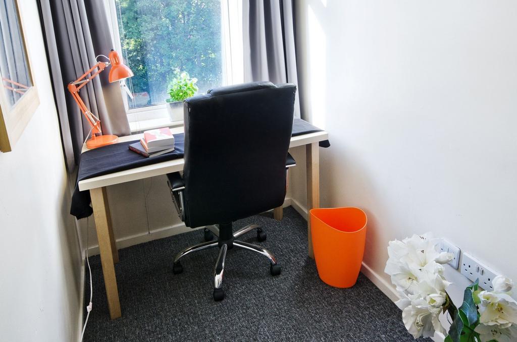 Bright and tidy study nook with a simple desk b...