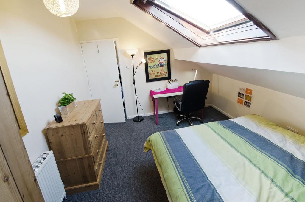 Bright, neatly furnished double bedroom with a ...