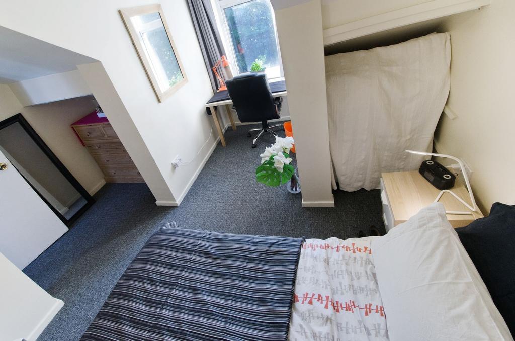 Bright, neatly presented bedroom with a double ...