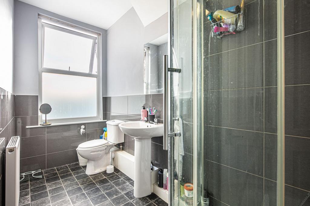 Bright, contemporary bathroom with a large fros...