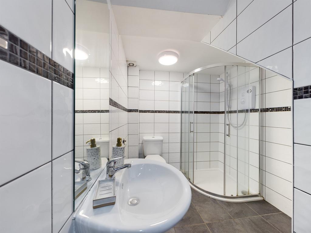 A modern and stylish bathroom featuring a sleek...