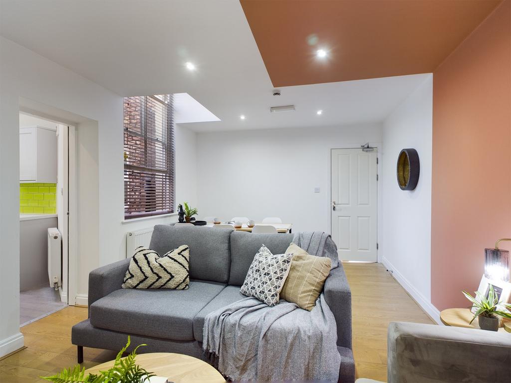 A spacious and stylish modern living room fille...