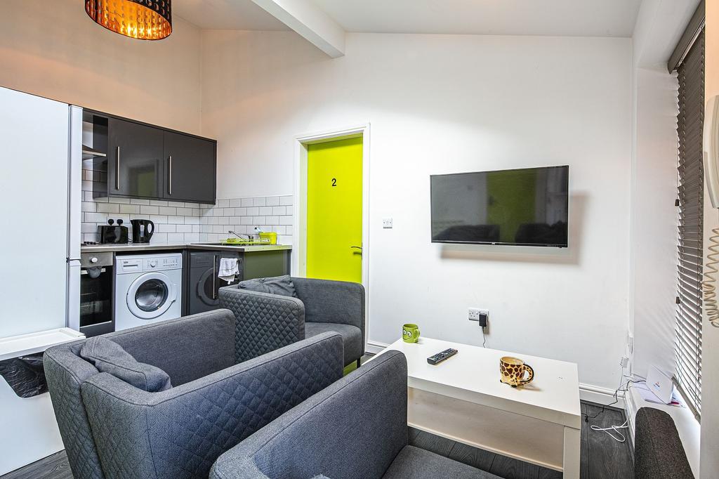 Bright, modern open-plan living area with a com...