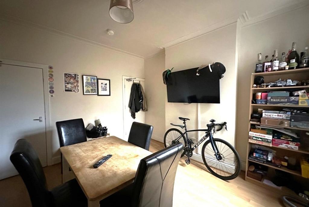 Bright, well‑kept living/dining area with a din...