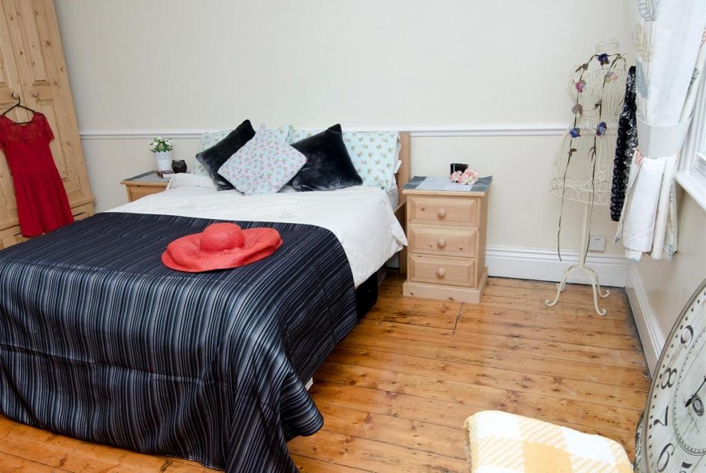 Bright, neatly presented bedroom with polished ...