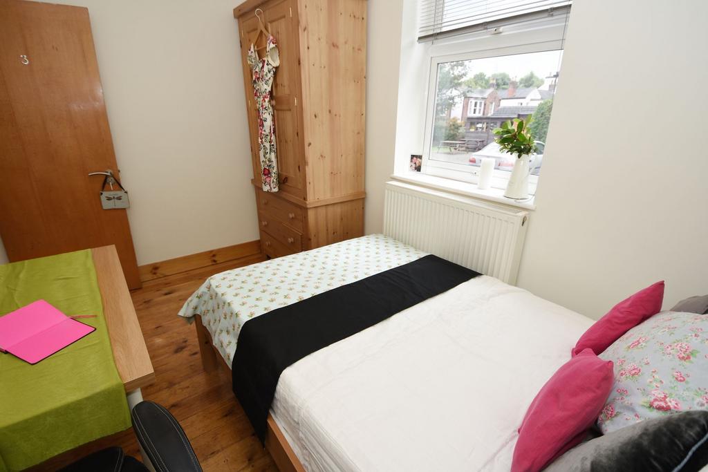 Bright, neatly presented bedroom with a comfort...