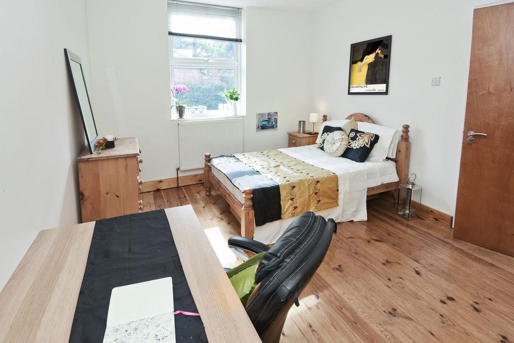 Bright, well-presented bedroom with wooden floo...