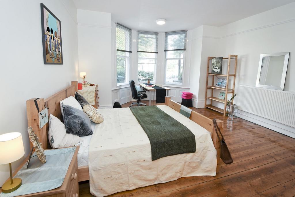 Bright, spacious double bedroom with wooden flo...
