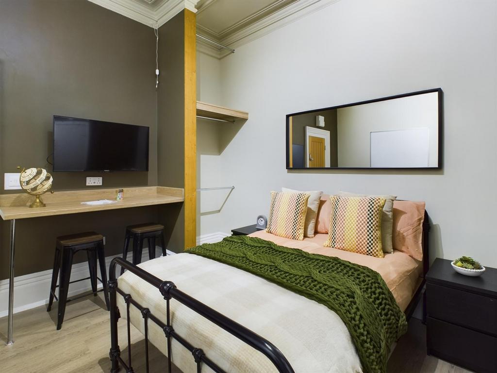 A stylish and inviting double bedroom featuring...