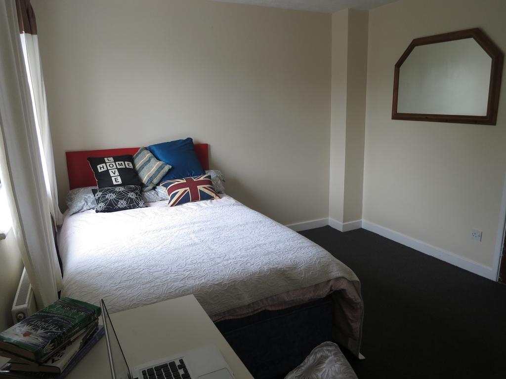 A bright and inviting double bedroom featuring ...