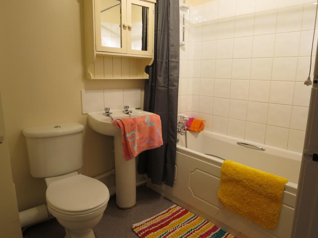 A tidy and well-maintained bathroom featuring a...