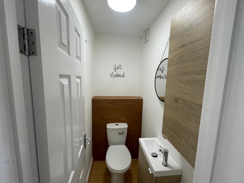 A modern and tidy single toilet with stylish de...