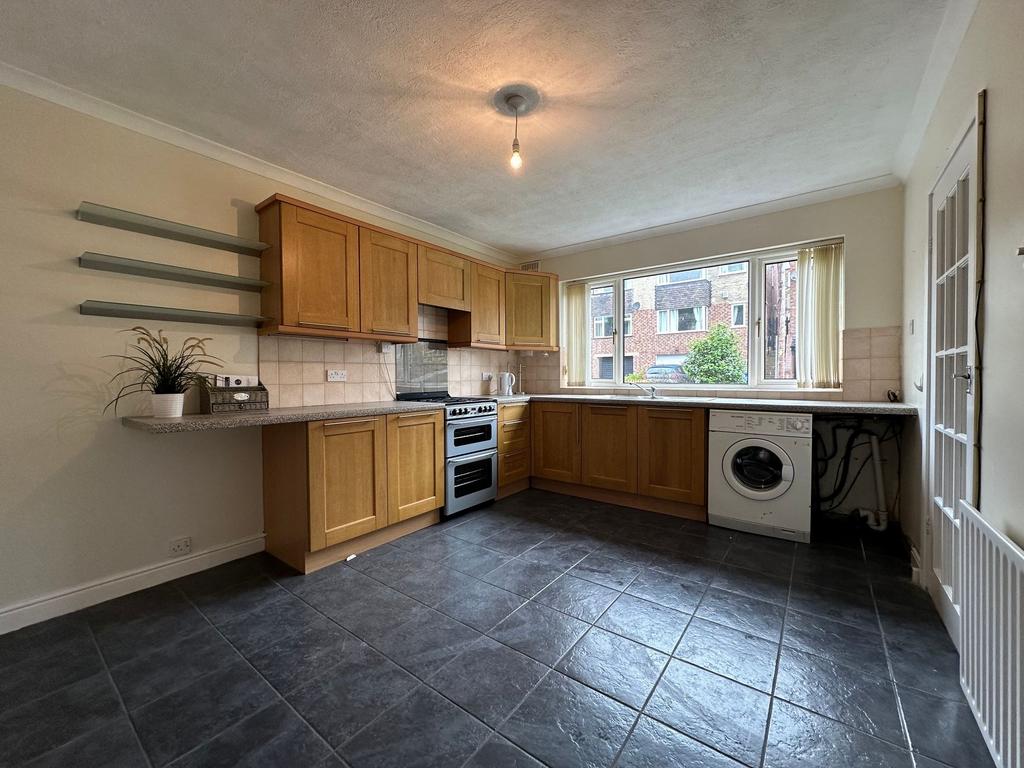 Bright kitchen with abundant counter space, woo...