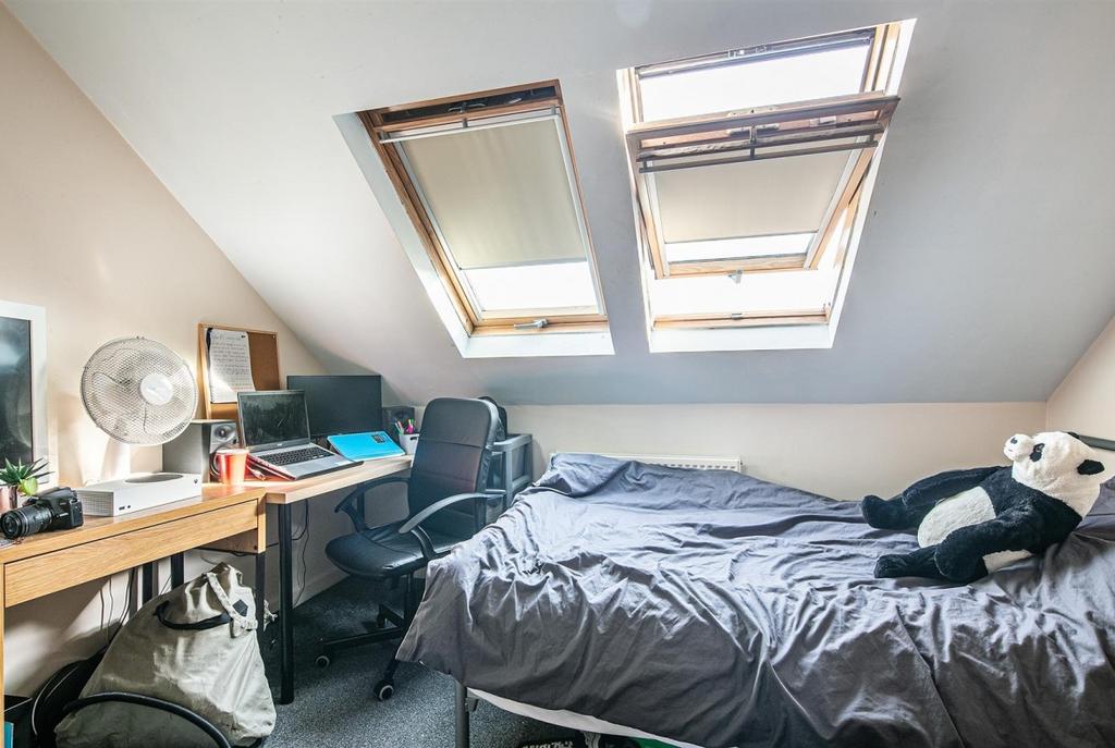 Bright attic double bedroom with two skylights,...